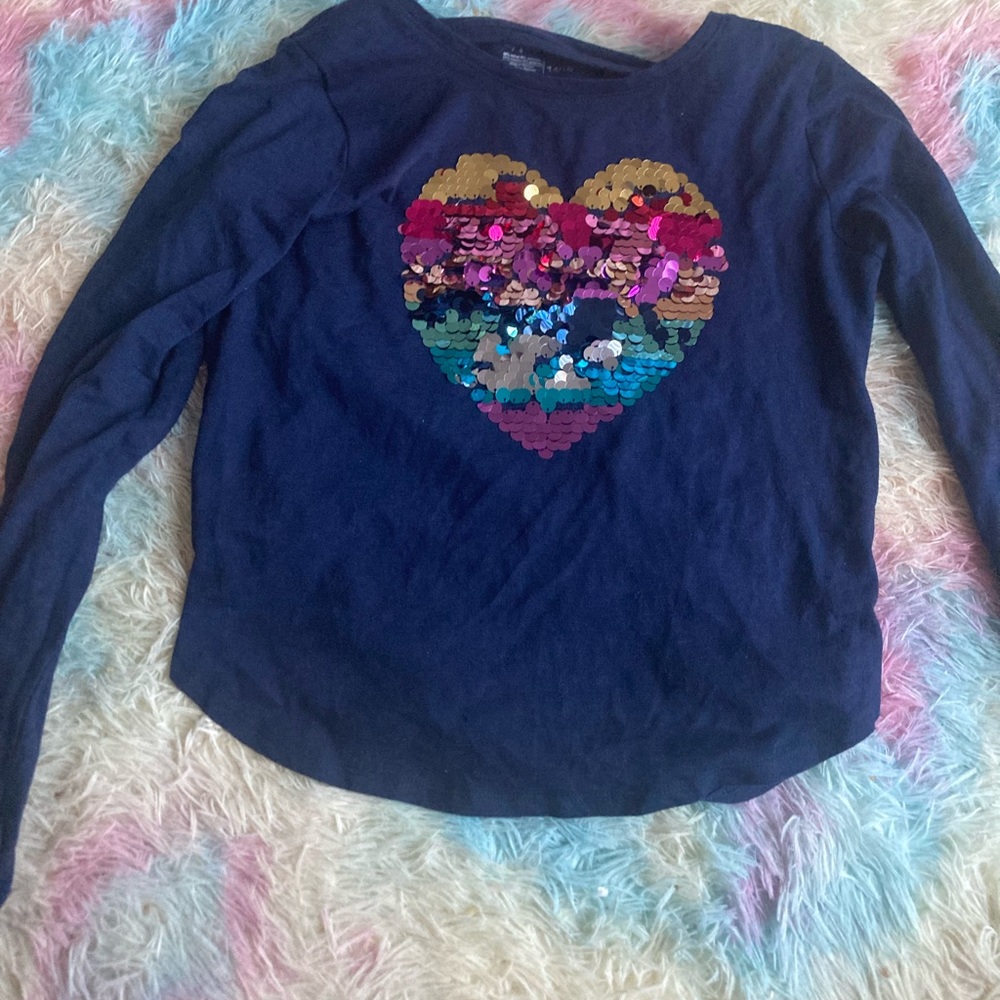 This is a sequence heart shirt for a little girl.
